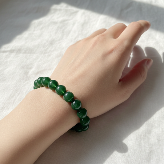 Green jade crystal bracelet worn on wrist - lifestyle shot