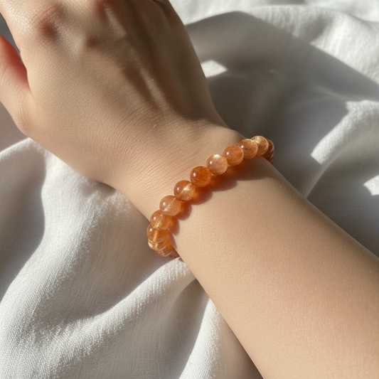 Sunstone crystal bracelet worn on wrist - lifestyle shot