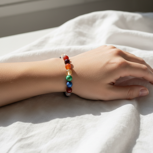 Seven chakra crystal bracelet worn on wrist - lifestyle shot