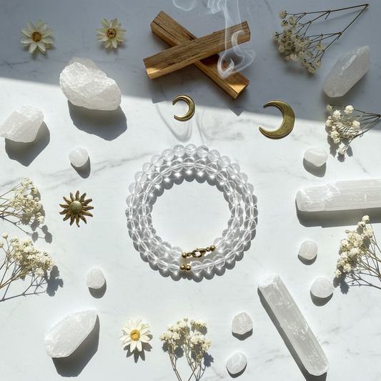 Clear Quartz crystal bracelet flat lay with natural elements and crystals