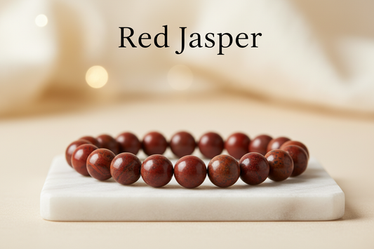 Red jasper single bracelet 8mm round beads on marble flat stand in the middle with holistic soft background with Red Jasper written